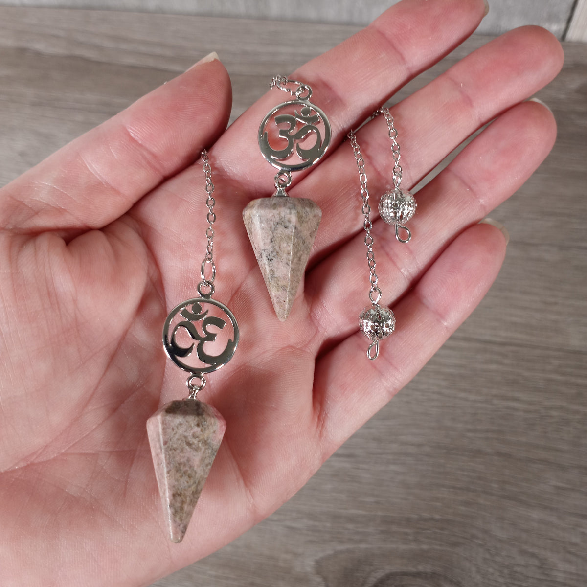 Rhodonite Aum symbol Reiki pendulum for spiritual divination