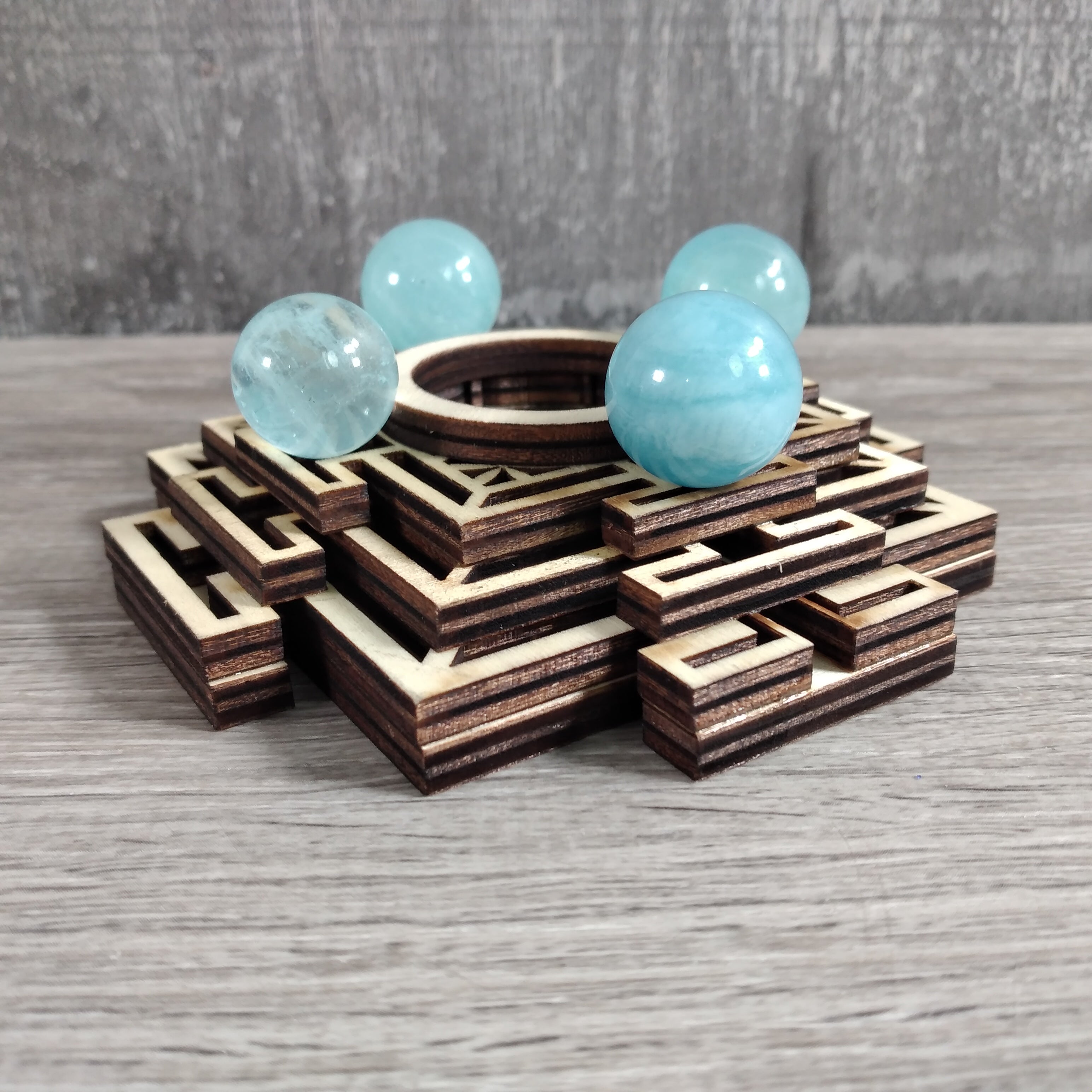 Sacred Geometry Wooden Stand Holding Crystal Sphere