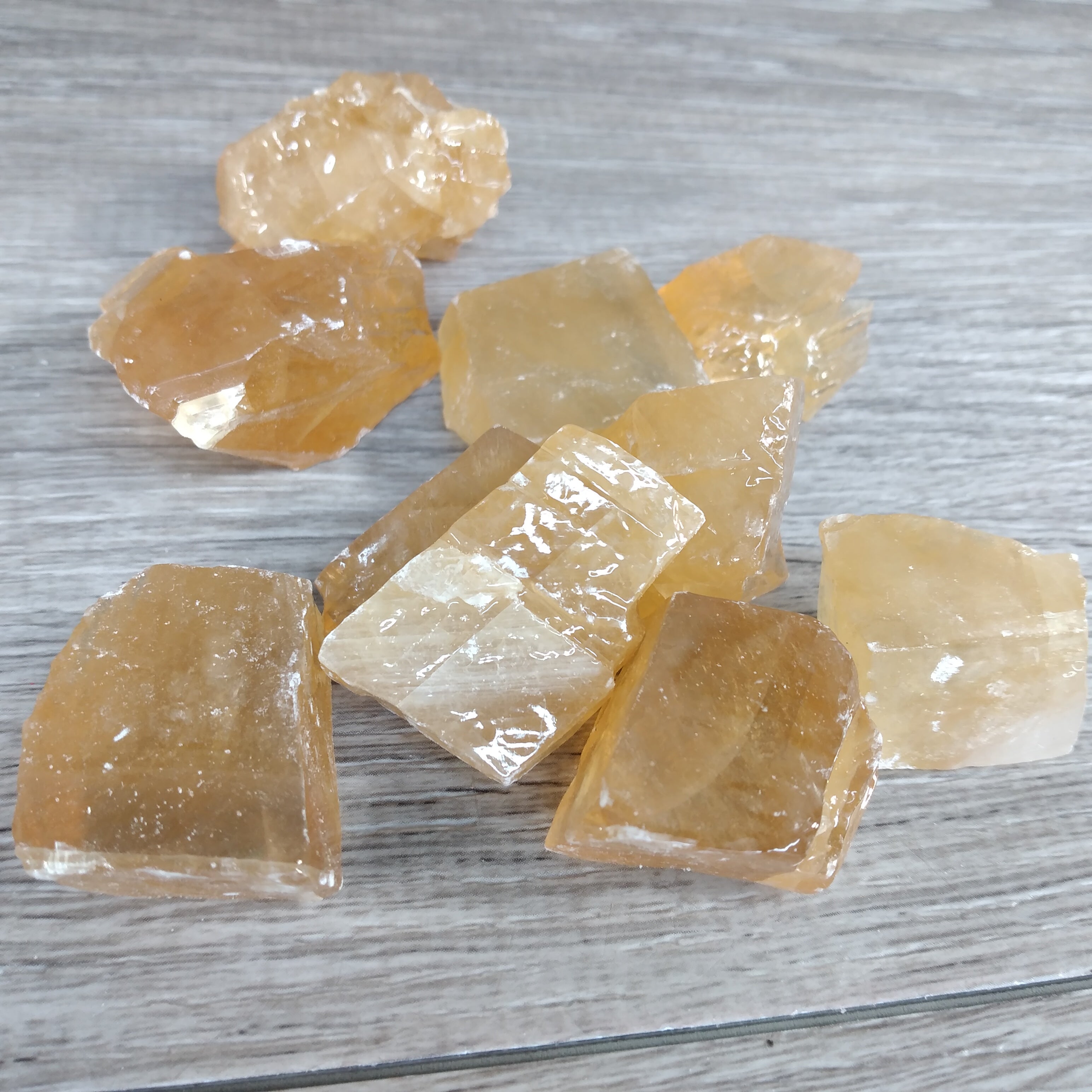 Natural honey calcite crystal pieces for metaphysical resale