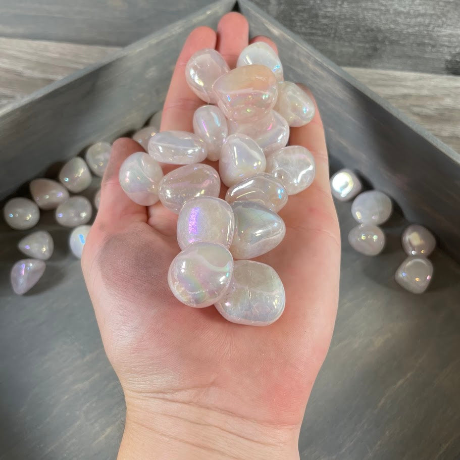Bulk rose aura tumbled stones with polished pink iridescent crystal finish