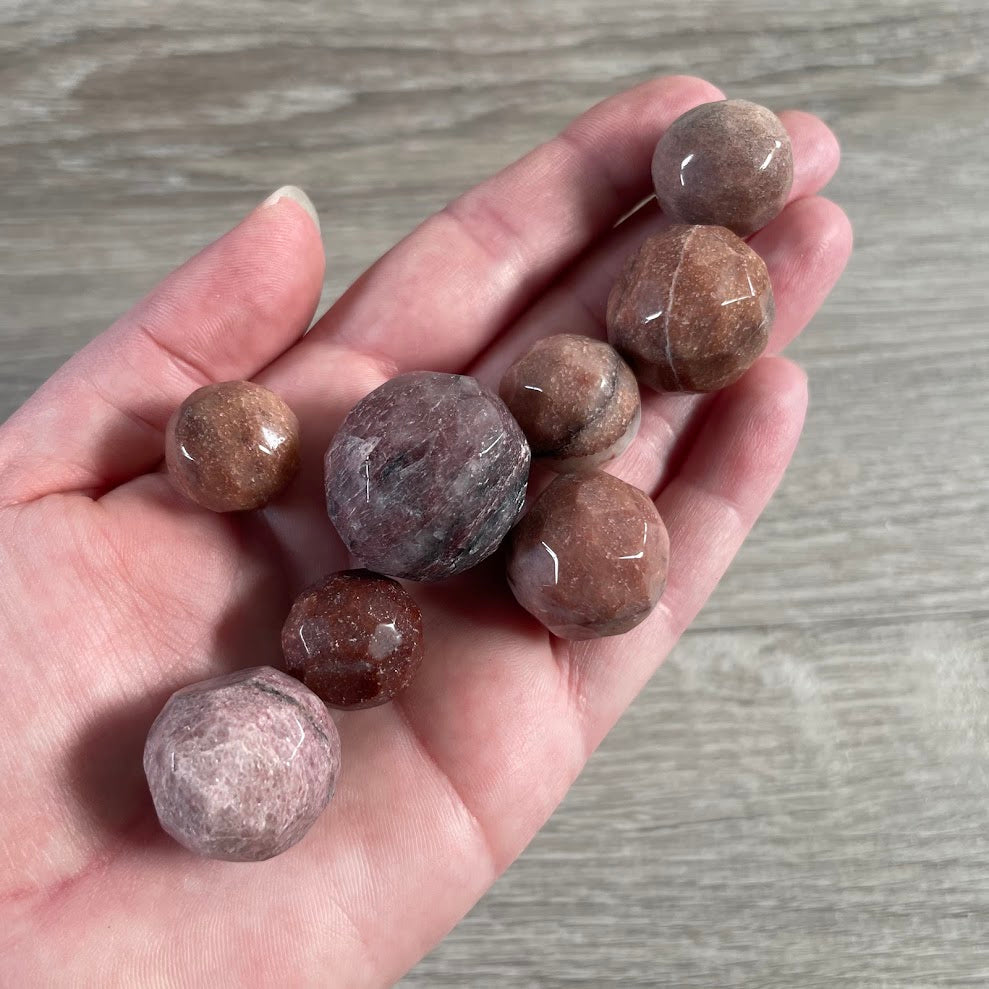 red aventurine small faceted gemstone sphere with polished crystal ball shape and natural stone variations for bulk buyers