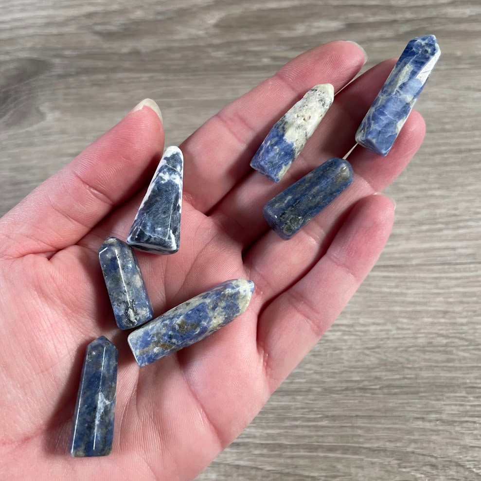 Small sodalite wholesale gemstone obelisk from Brazil for crystal stores and gift retailers.