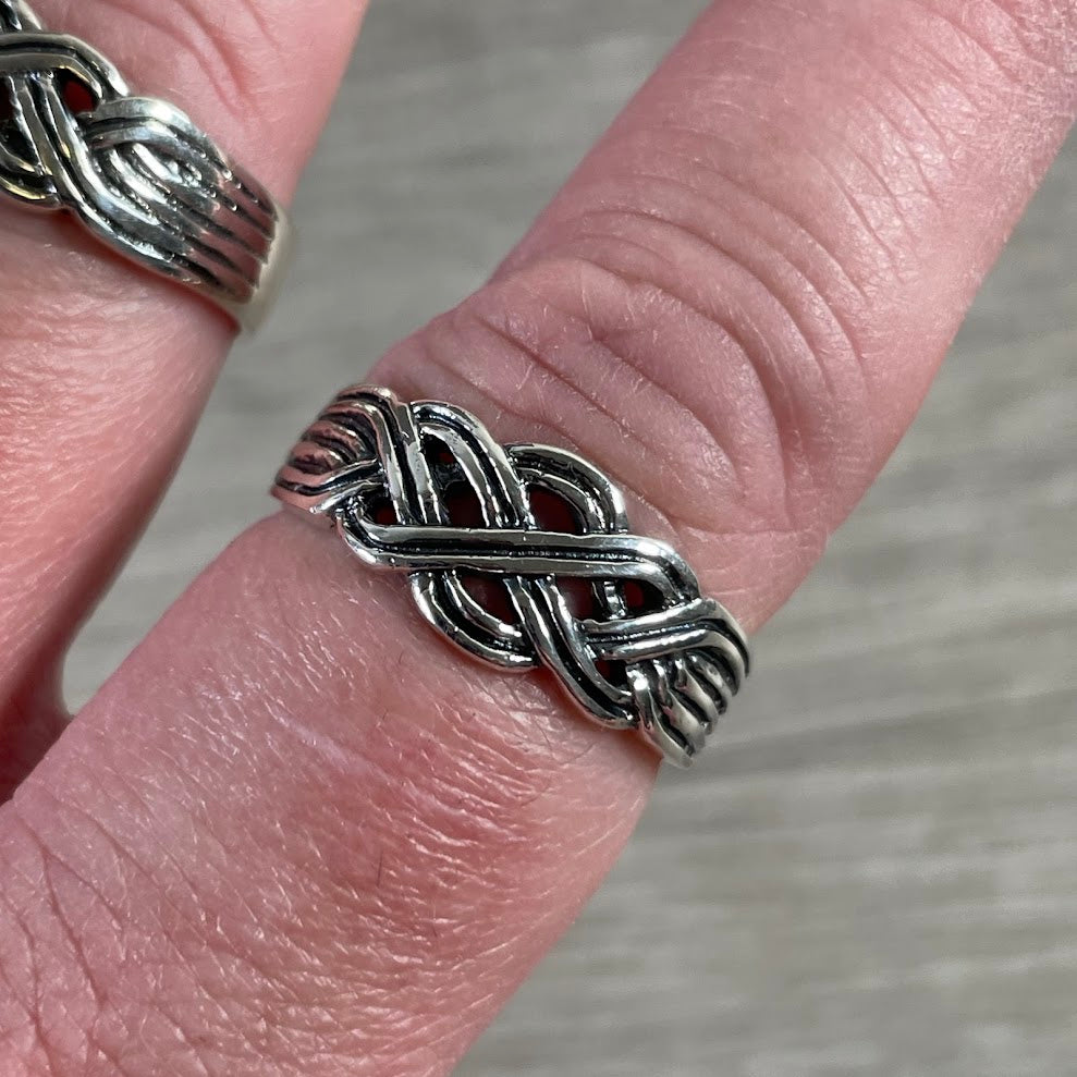 Sterling silver Celtic knot ring with braided infinity band design for wholesale jewelry retailers