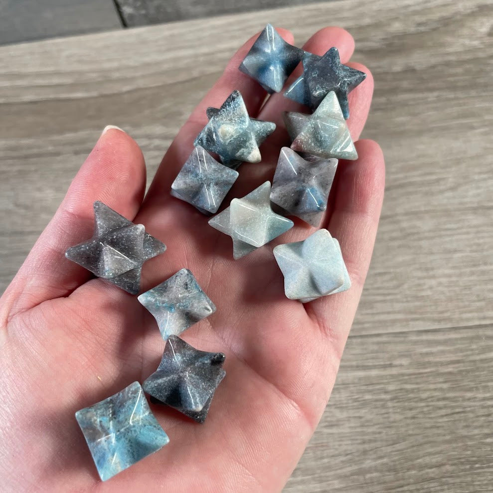 Trollite wholesale gemstone Merkaba carvings featuring polished Brazilian crystals and sacred geometry shapes