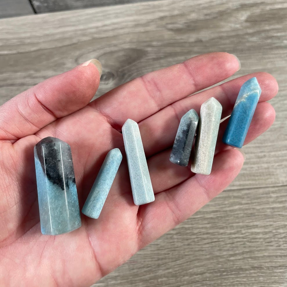 Small handmade trollite gemstone obelisk toweres from Brazil with natural color and pattern variations.