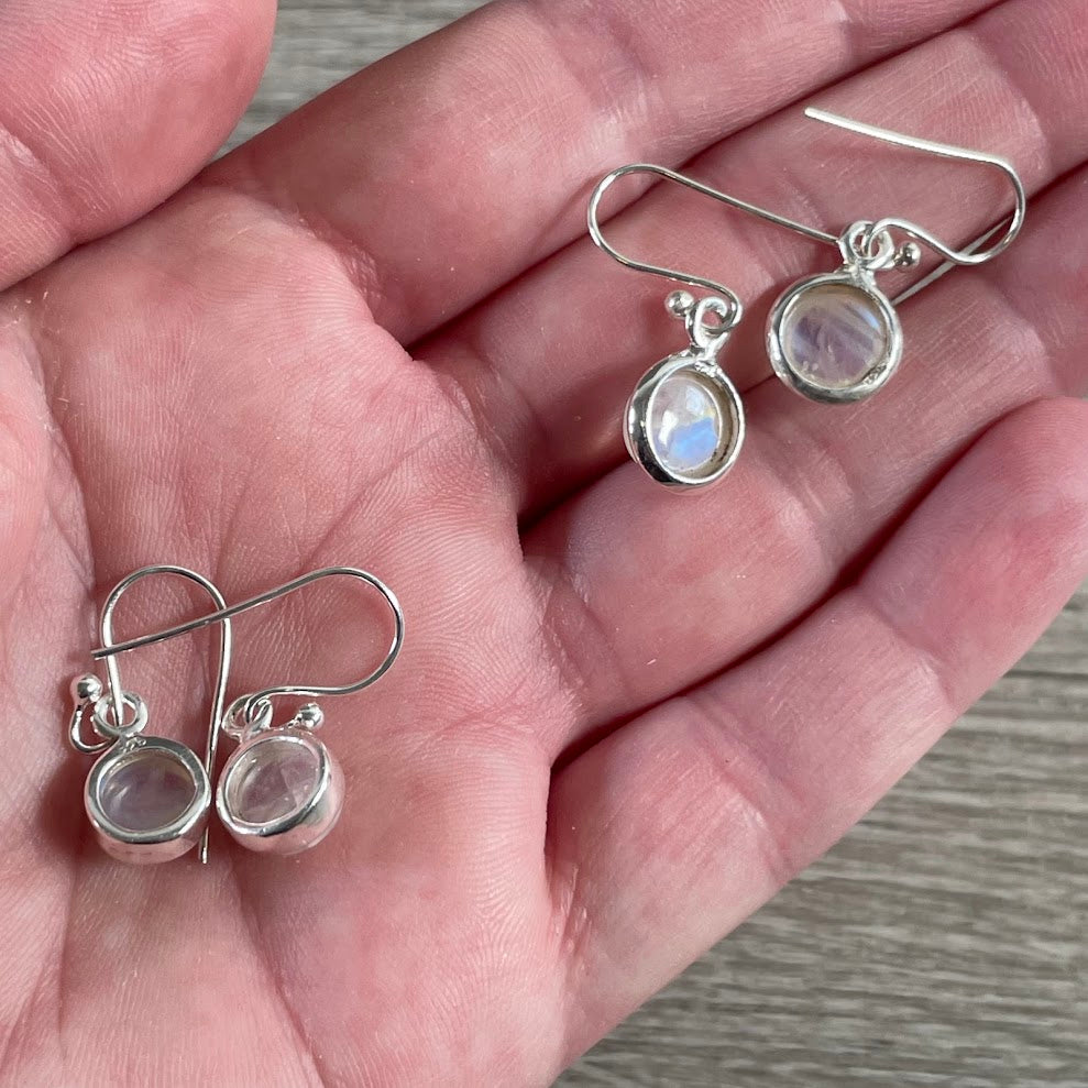 Natural white rainbow moonstone sterling silver hook earrings with iridescent gemstone flashes - back side