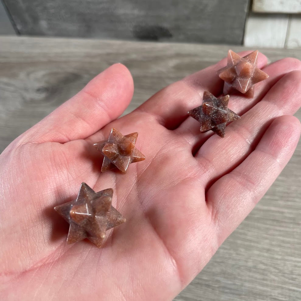 Polished red aventurine sacred geometry double Merkaba crystal carving