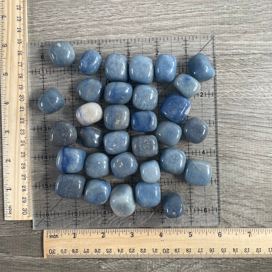 Wholesale tumbled blue quartz crystal stones for retailers, metaphysical shops, rock stores, and collections
