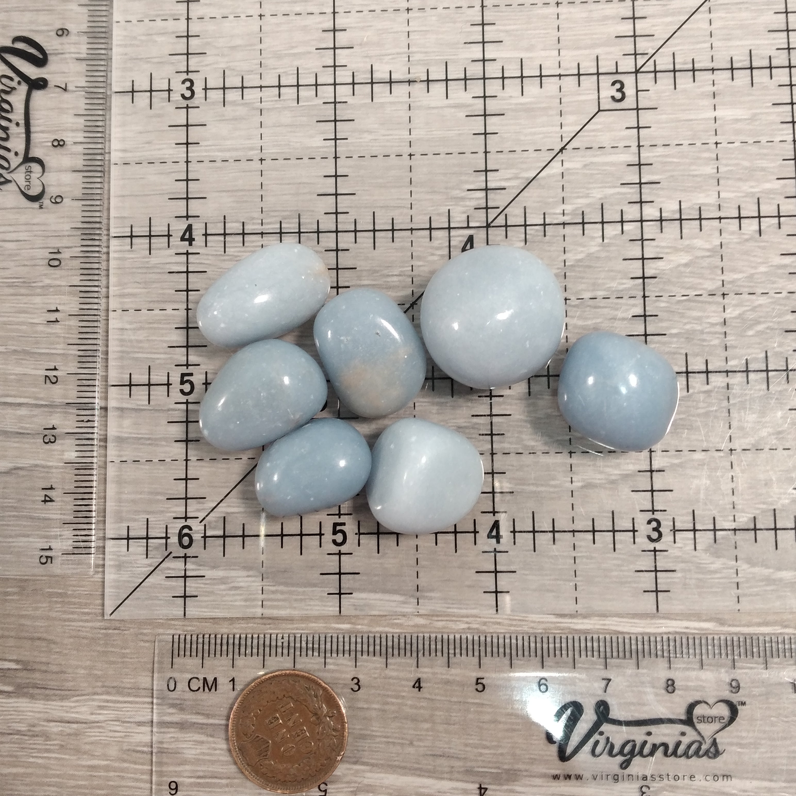 Wholesale tumbled Angelite stones on display tray