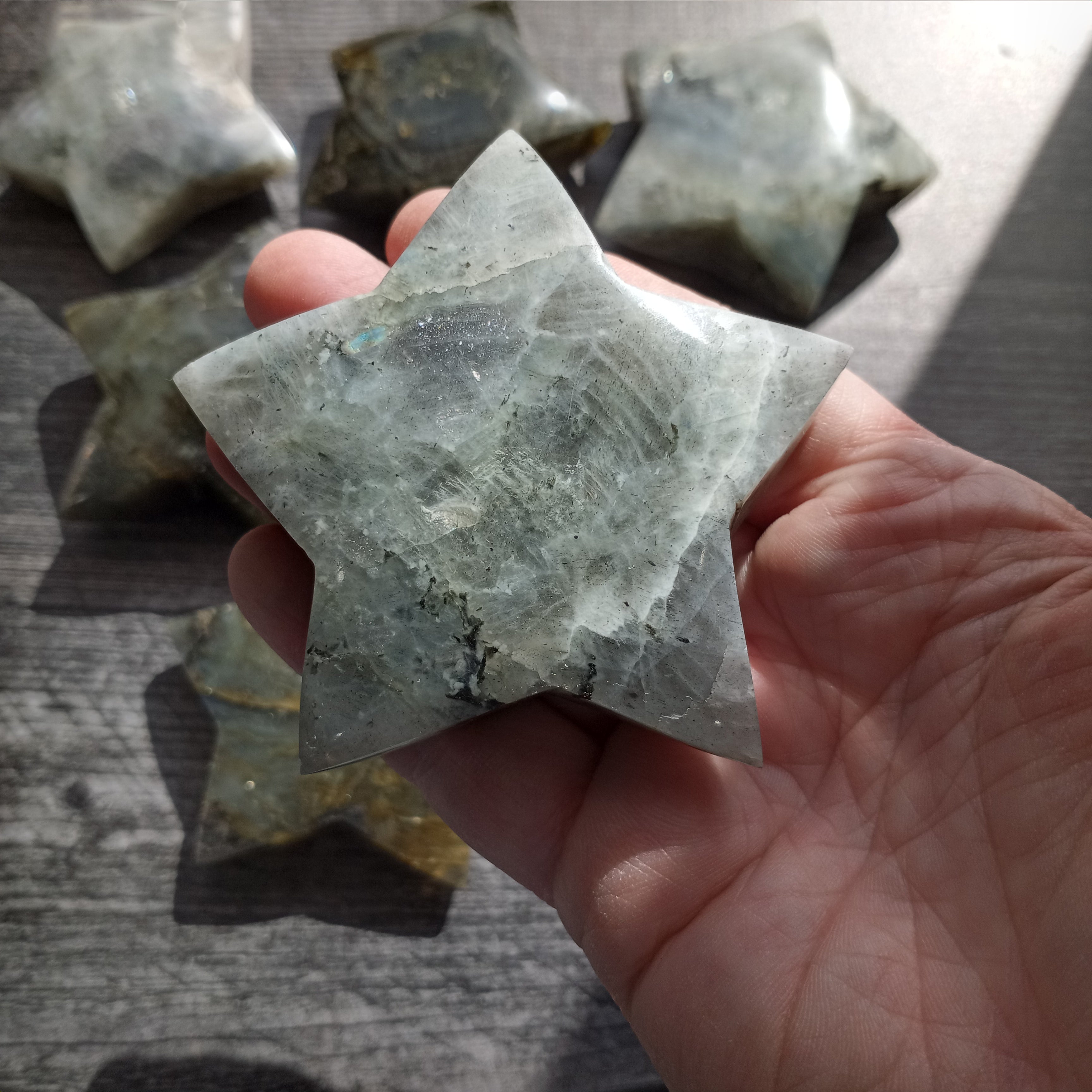 Chunky labradorite star crystal carving gift shop display