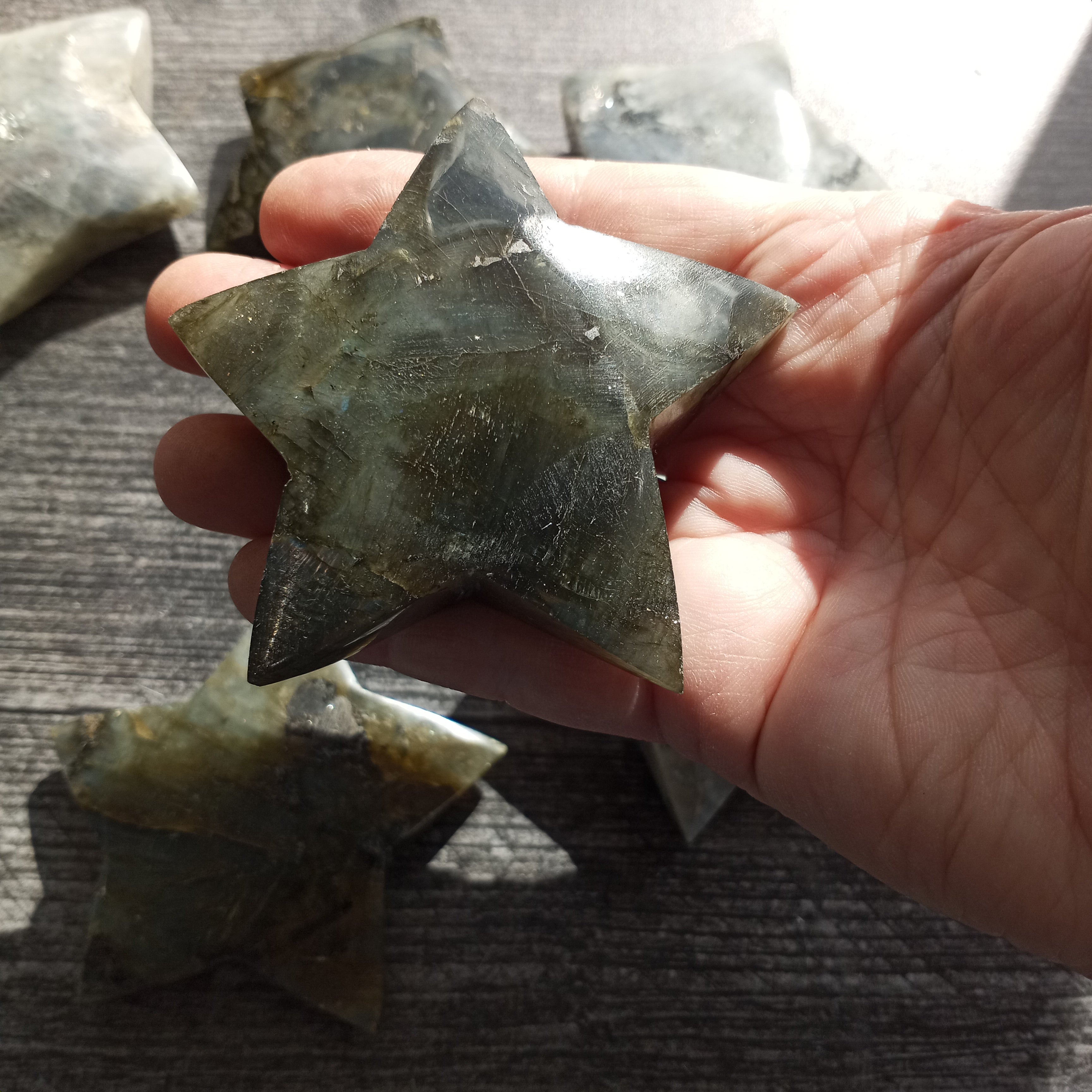 Wholesale labradorite star carving with flashes of blue and gold