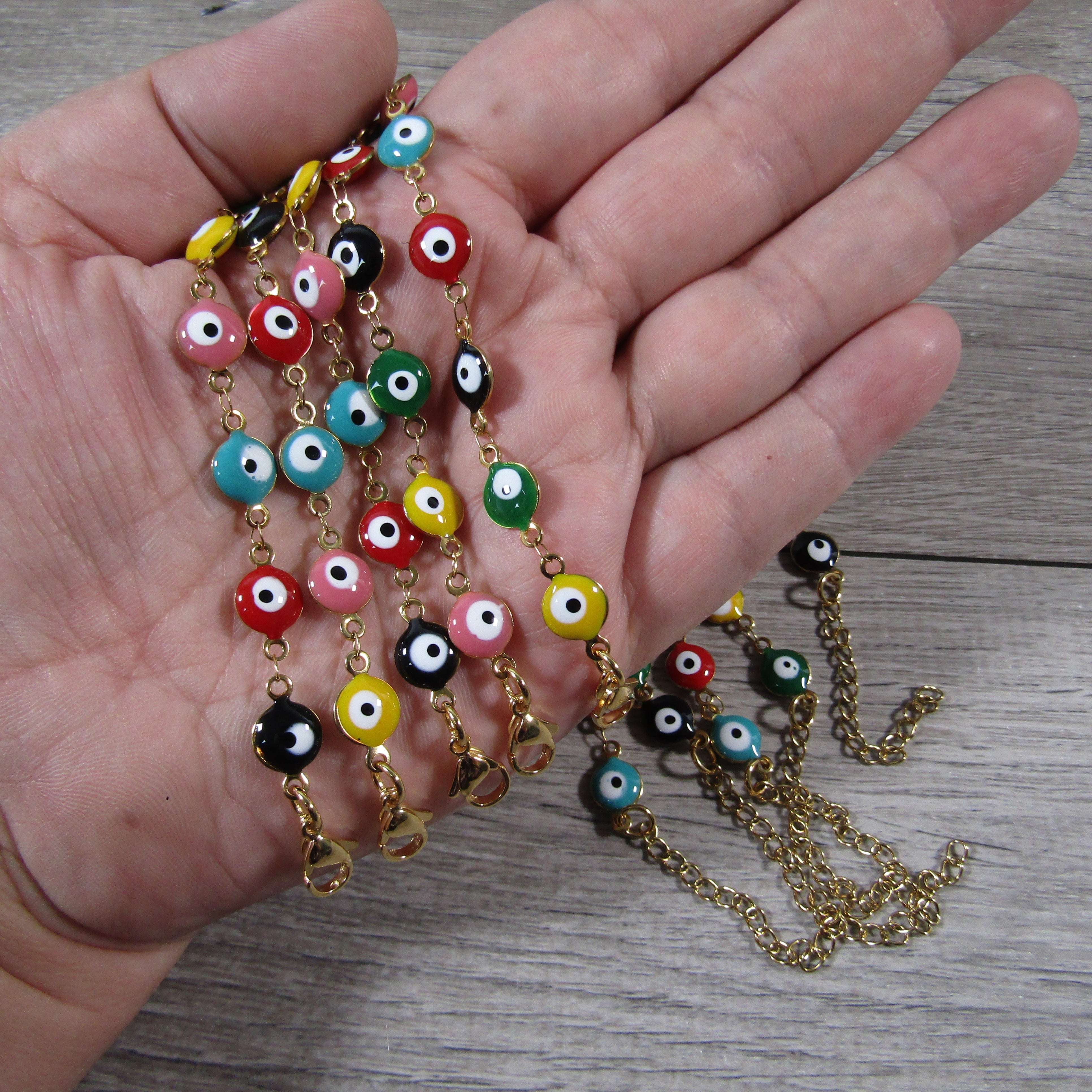 Gold evil eye bracelet with adjustable band for wholesale