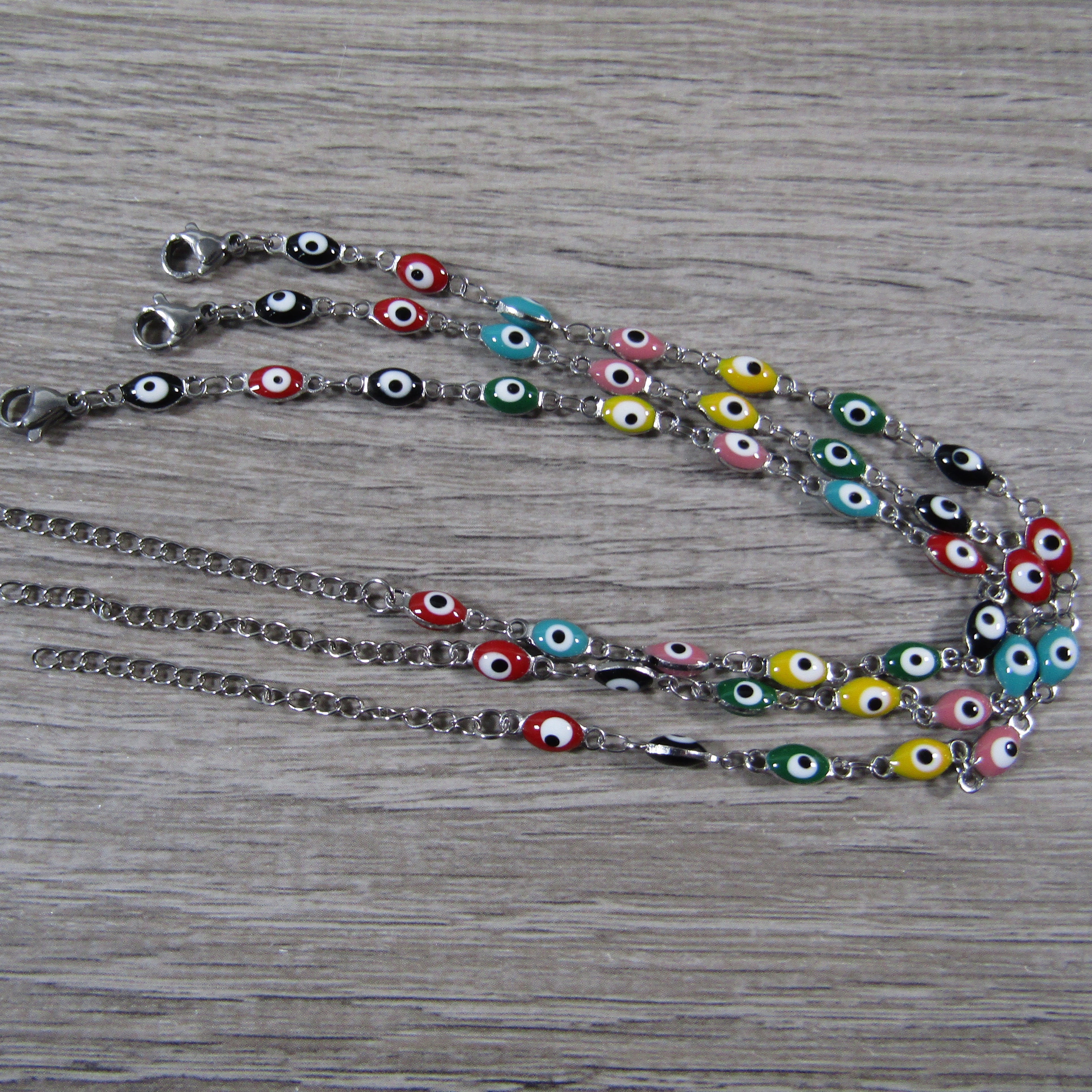 Adjustable anklet bracelet with blue evil eye charm