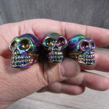 Iridescent glass skull figurine for metaphysical and spiritual shops.