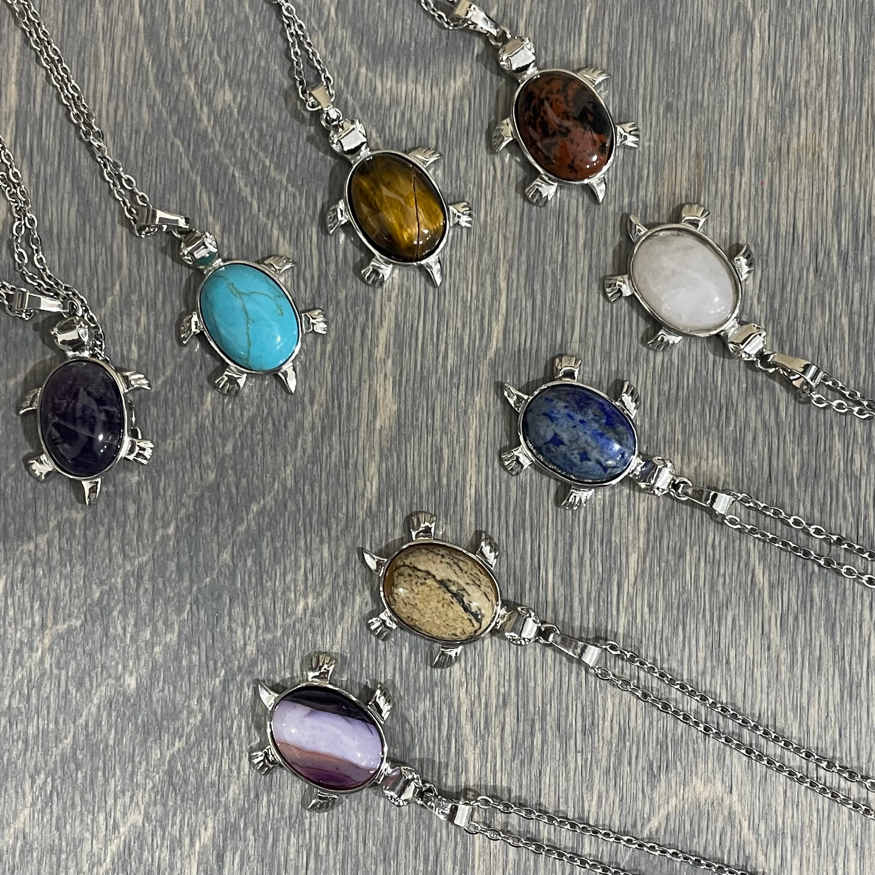 Assorted crystal turtle pendants for gift stores