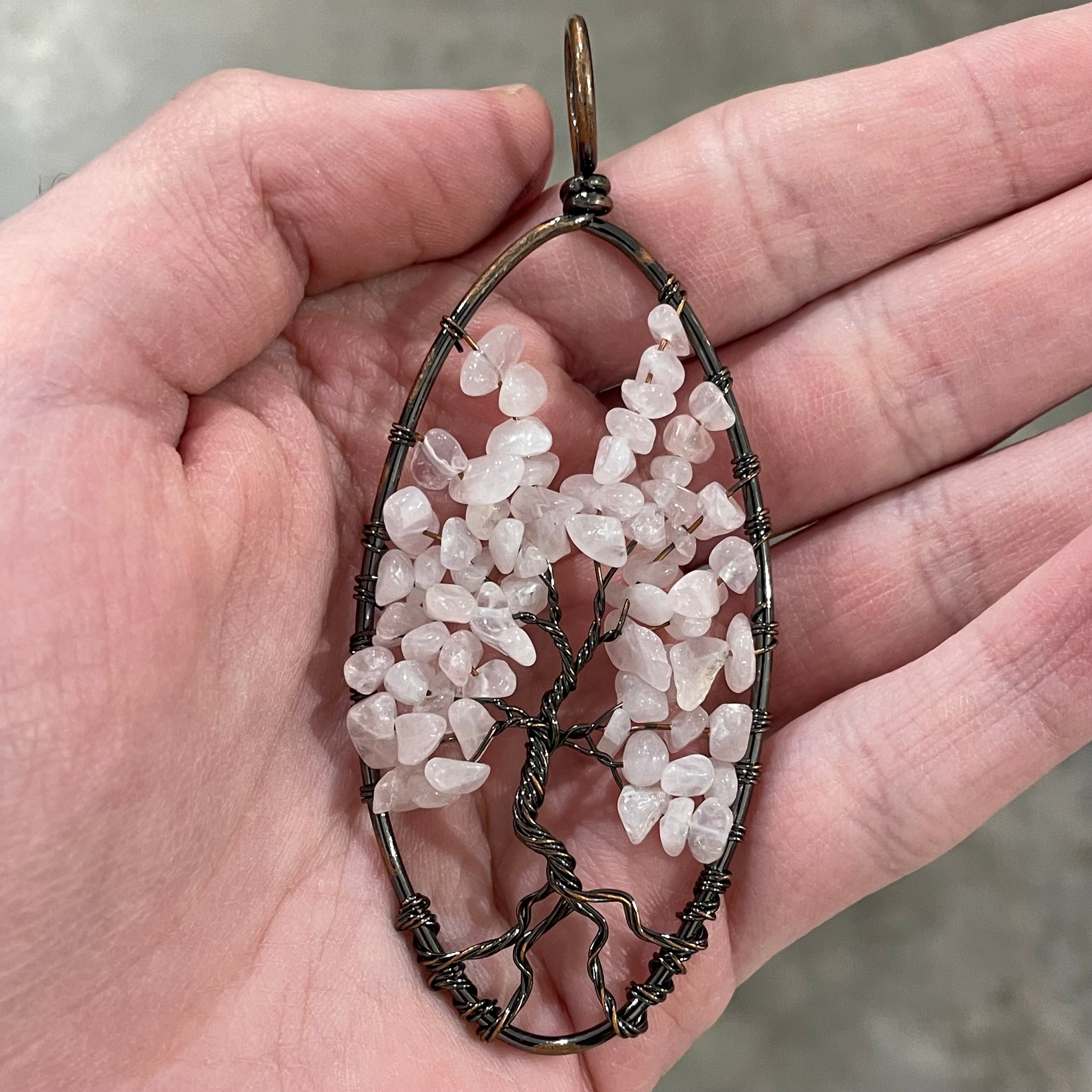Rose quartz tree of life pendant for resale.