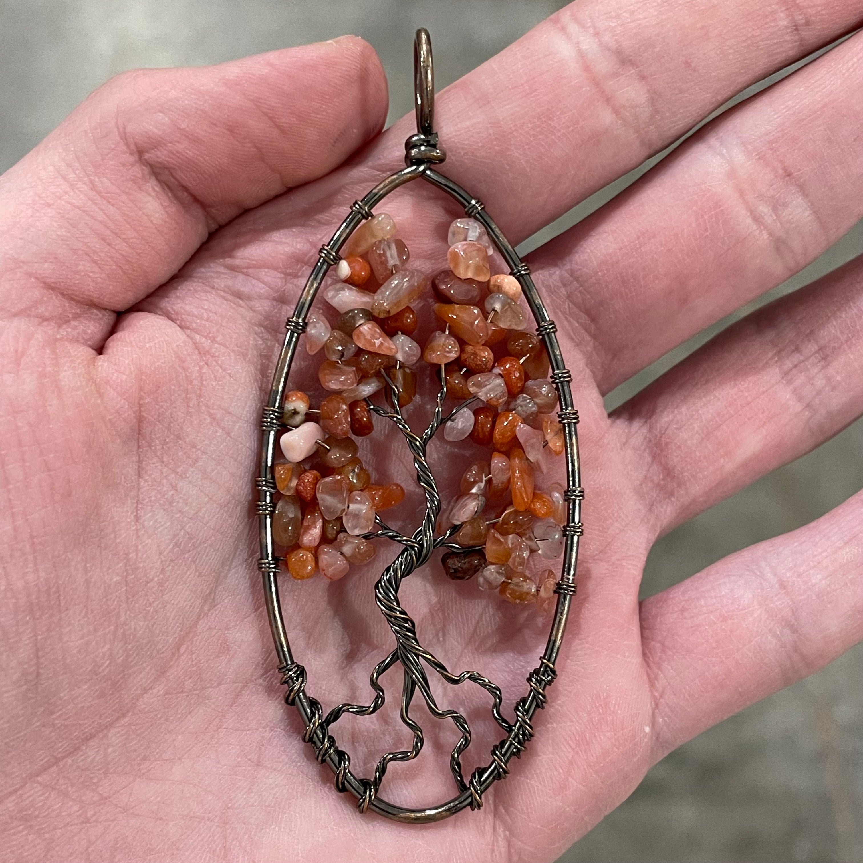 Carnelian oval-shaped Tree of Life pendant in bronze for retailers.