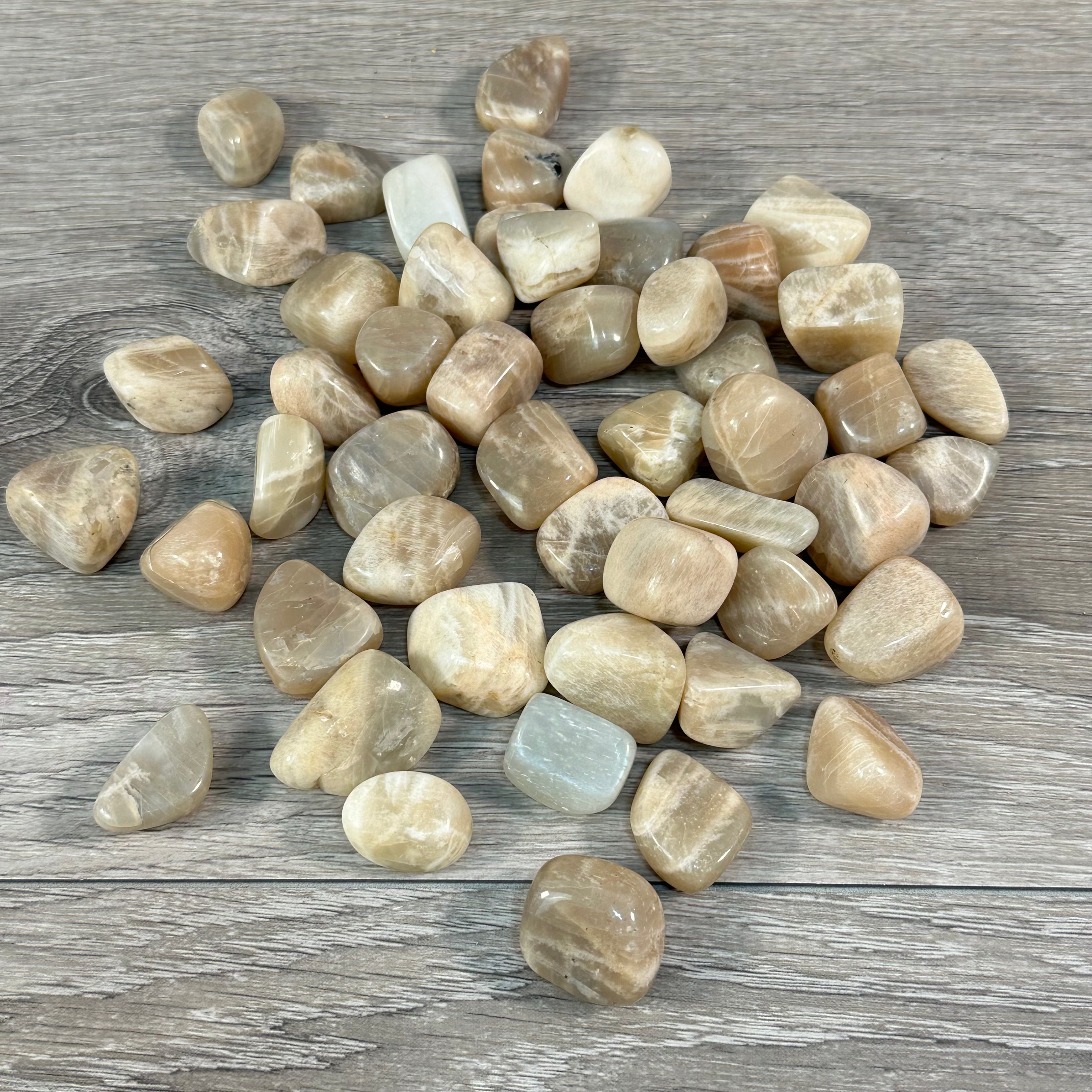 Wholesale Peach Moonstone tumbled stones ideal for spiritual healing displays