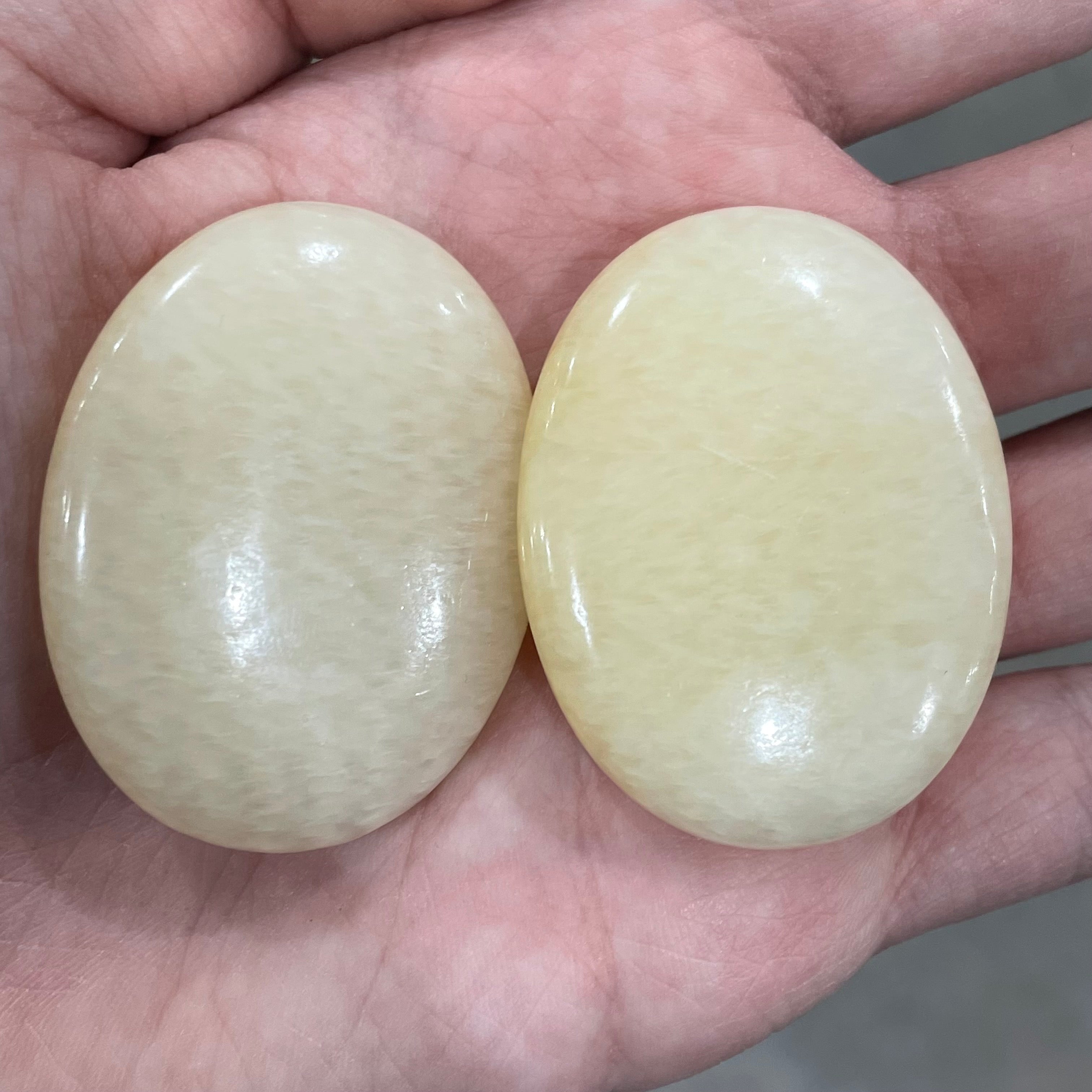 orange calcite polished oval stones bulk