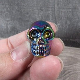 Crystal-inspired aura glass skulls for wholesale resale.