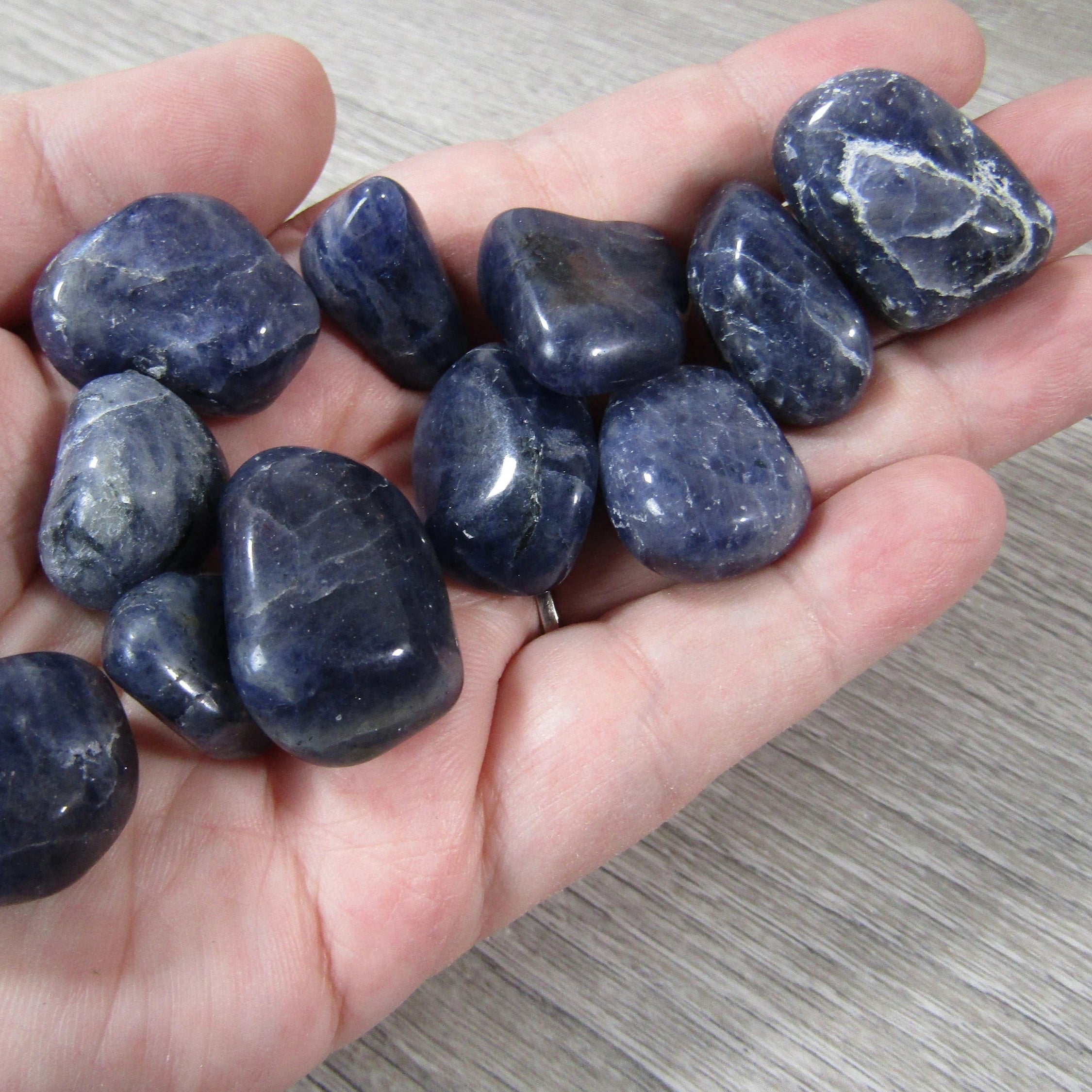 Premium tumbled Iolite stones ready for resale
