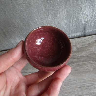 Maroon ceramic offering bowl for spiritual practices wholesale.