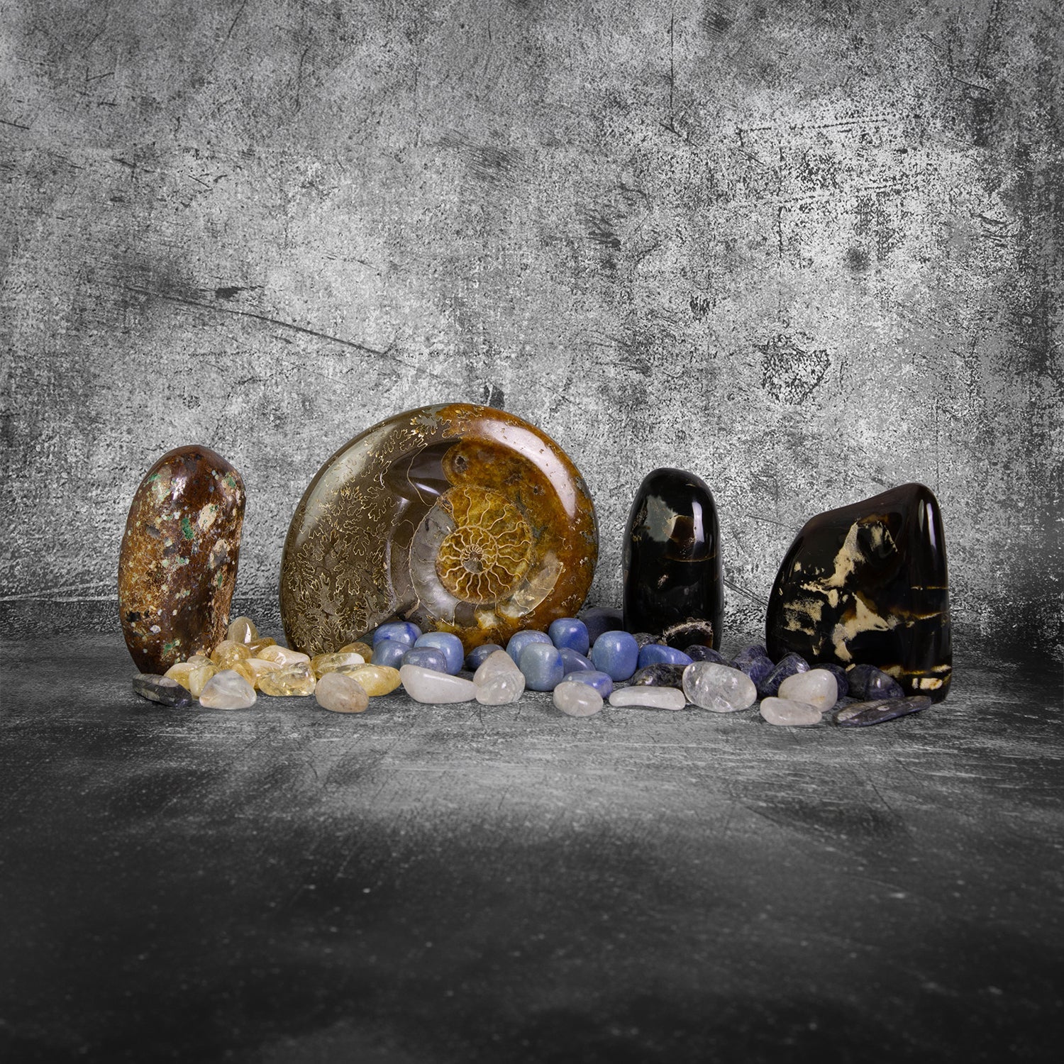 Wholesale tumbled stones, crystal freeforms, and natural fossils in assorted gemstones for metaphysical shops, boutiques, collectors, and gift retailers