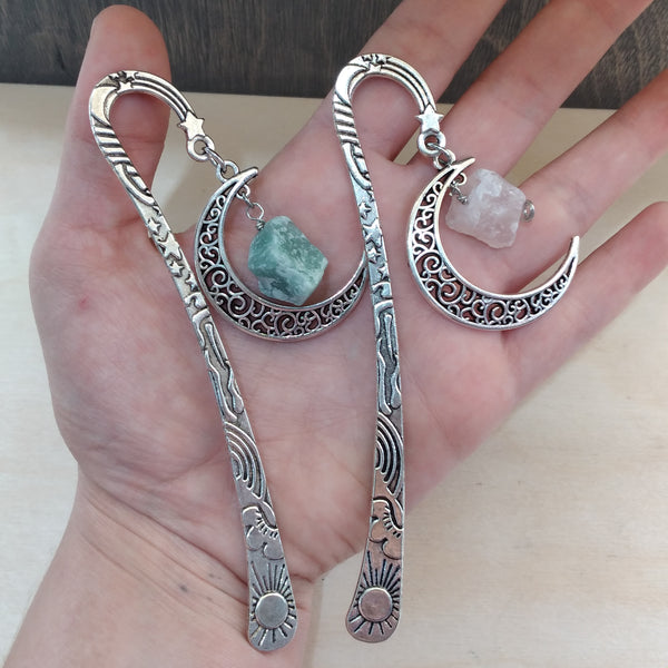 two gemstone bookmarks in hand.