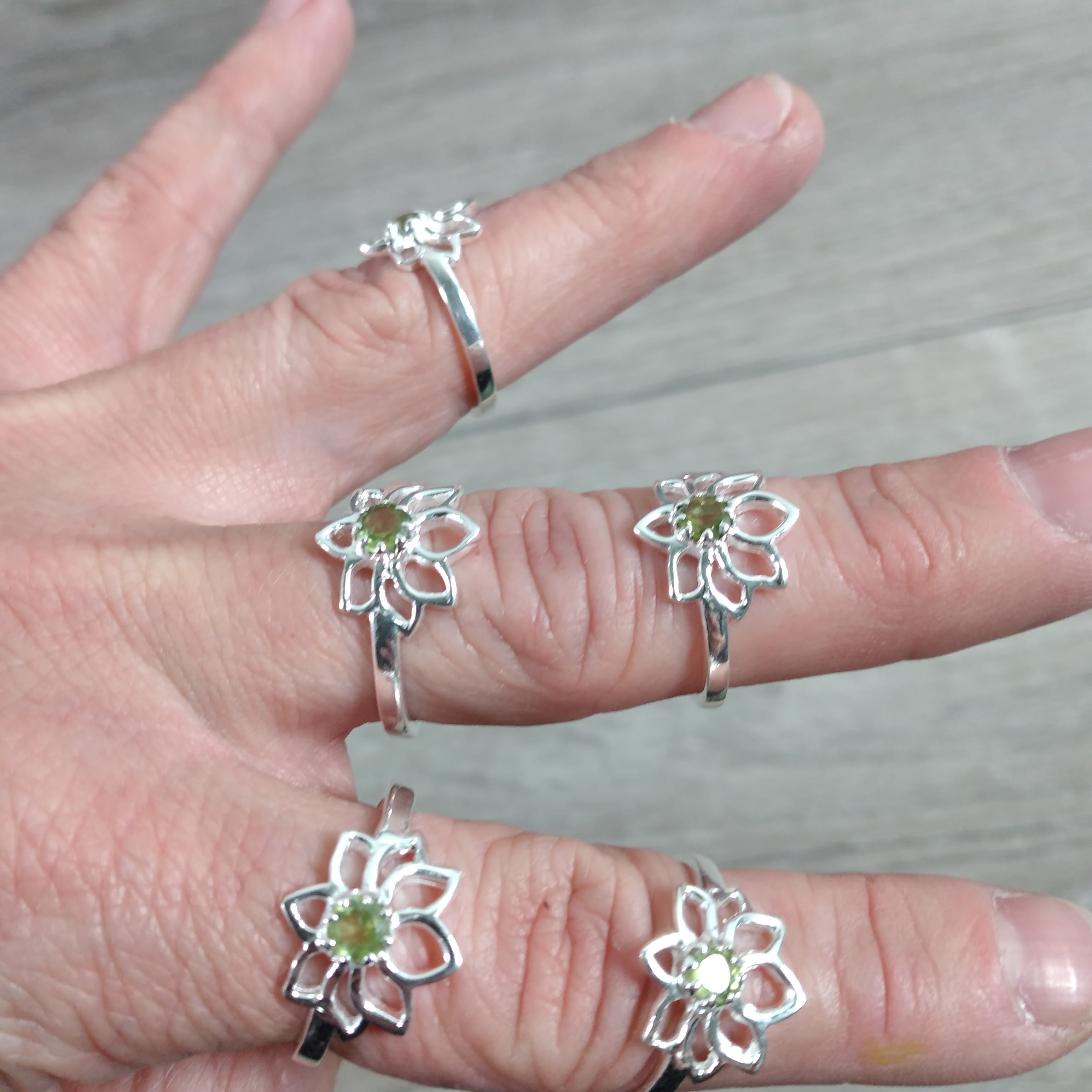 Sterling Silver ring with Lotus Flower setting and peridot center stone