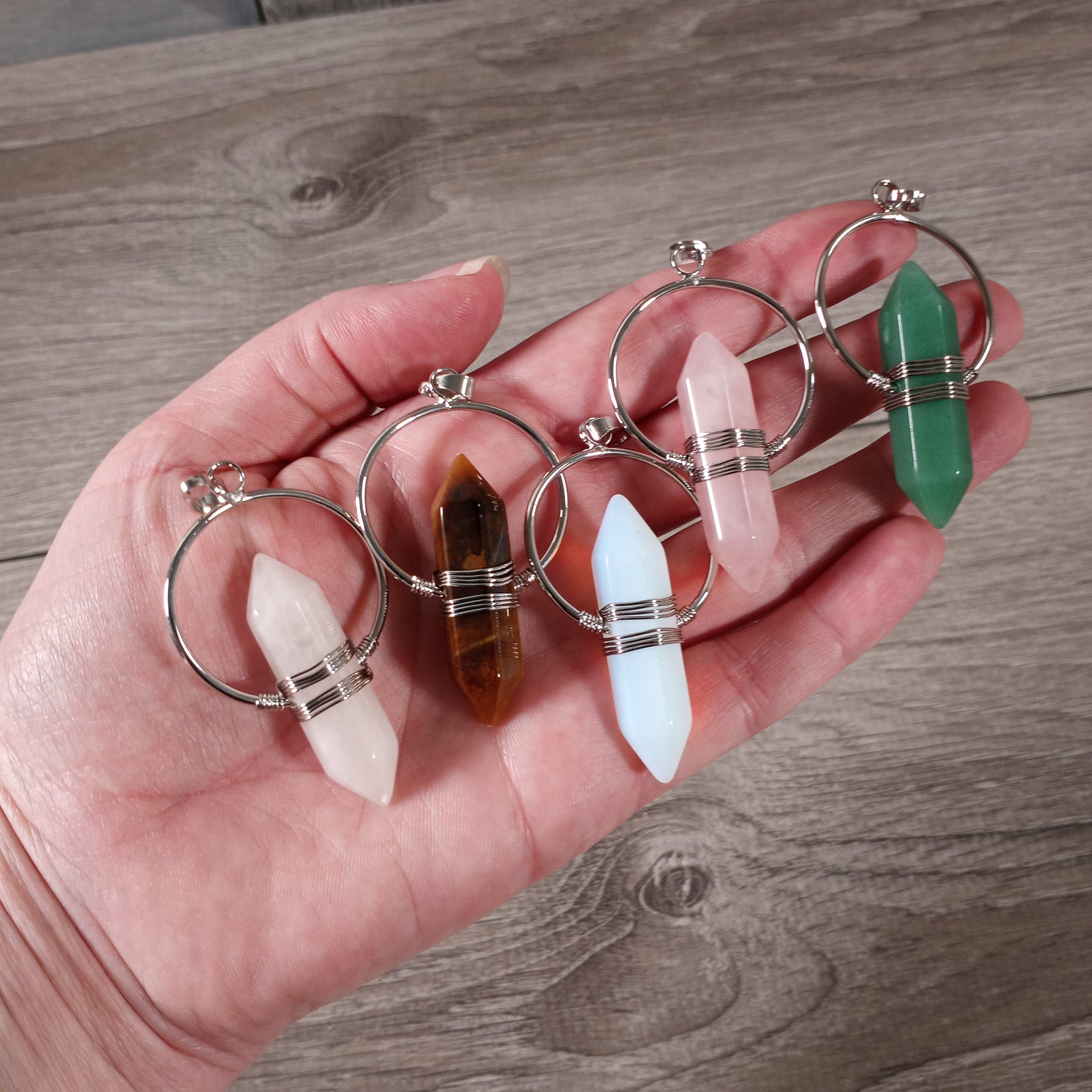 Assorted wire wrapped crystal point pendants for wholesale