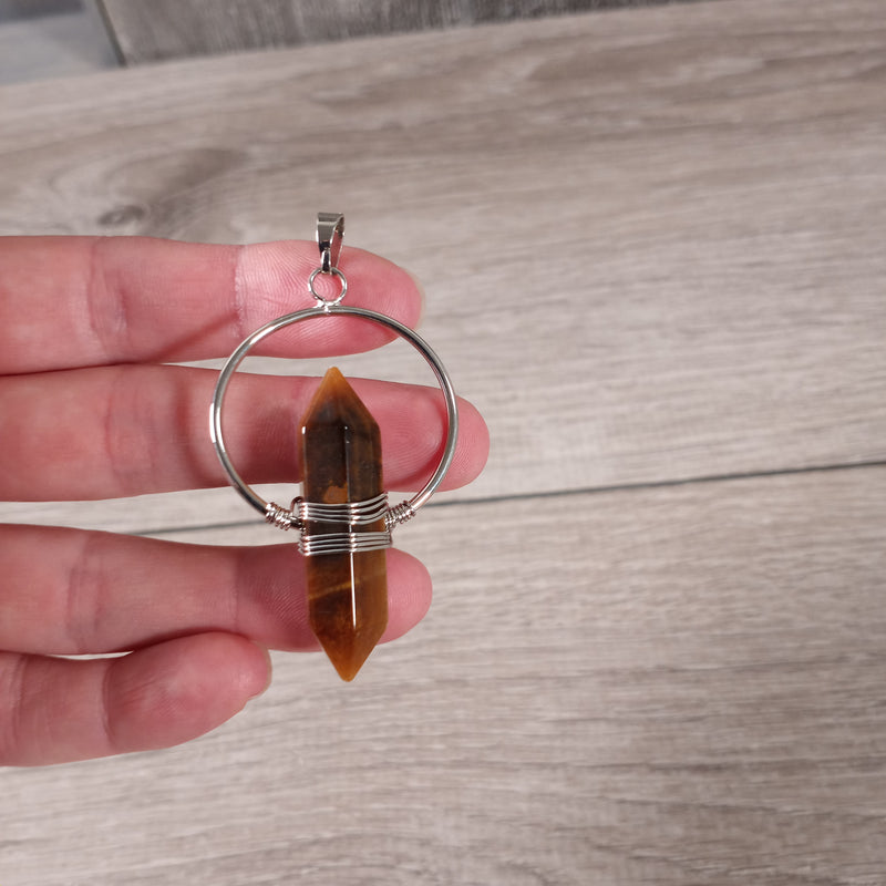 tiger eye double terminated pendant with a silver color metal