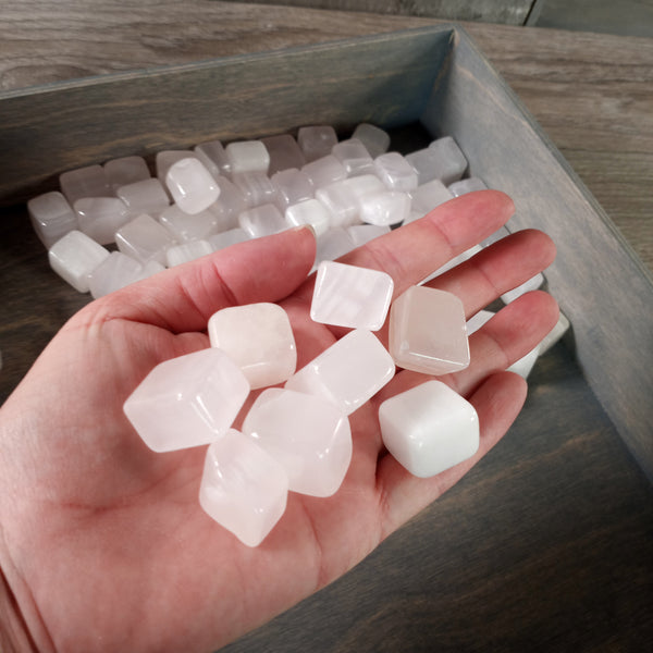 Pink Mangano Calcite tumbled stones in cubic style, sold by the kilo