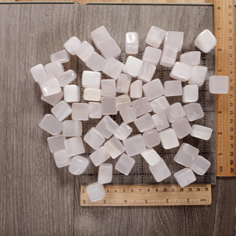 Close-up of tumbled Pink Mangano Calcite stones, cubic style, 1 kg pack