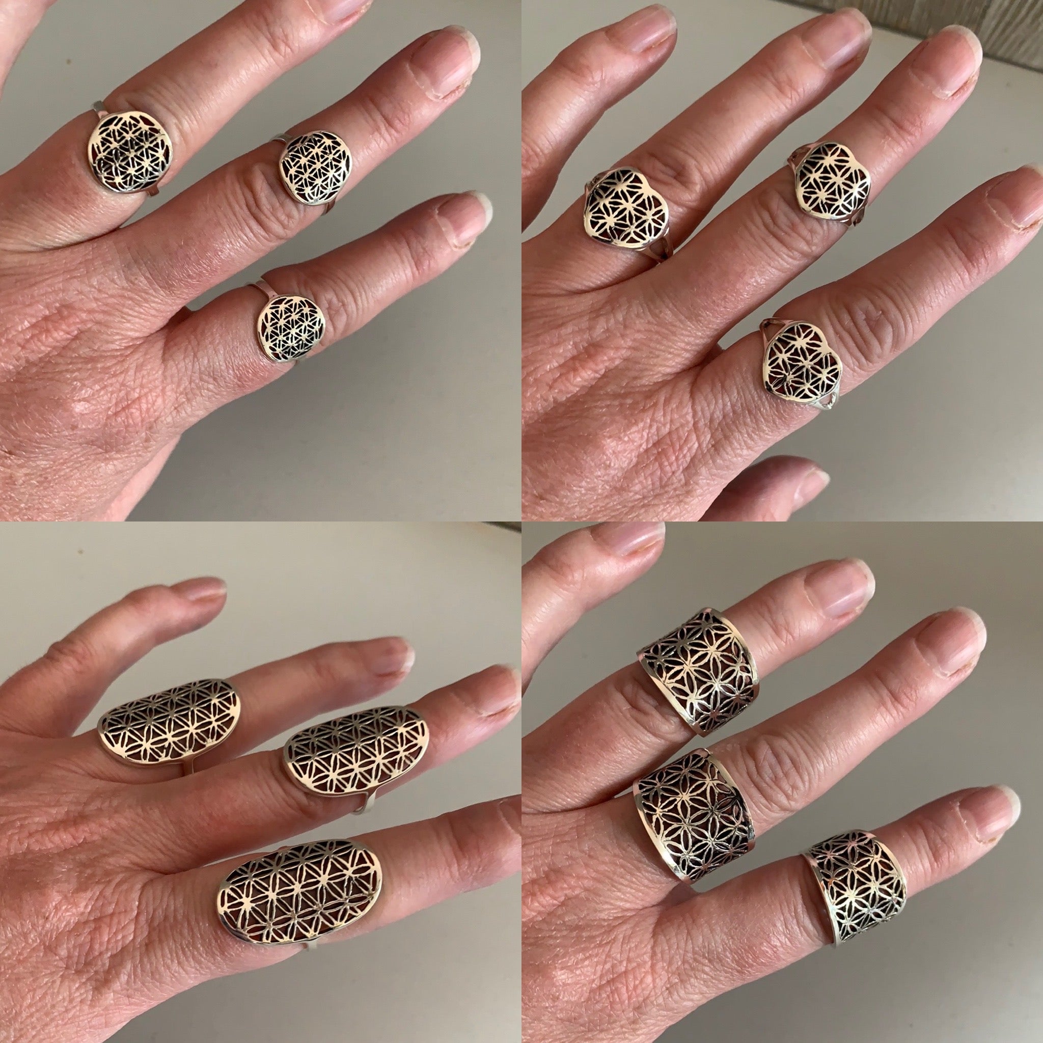 Group of sterling silver Flower of Life rings showcasing various designs.