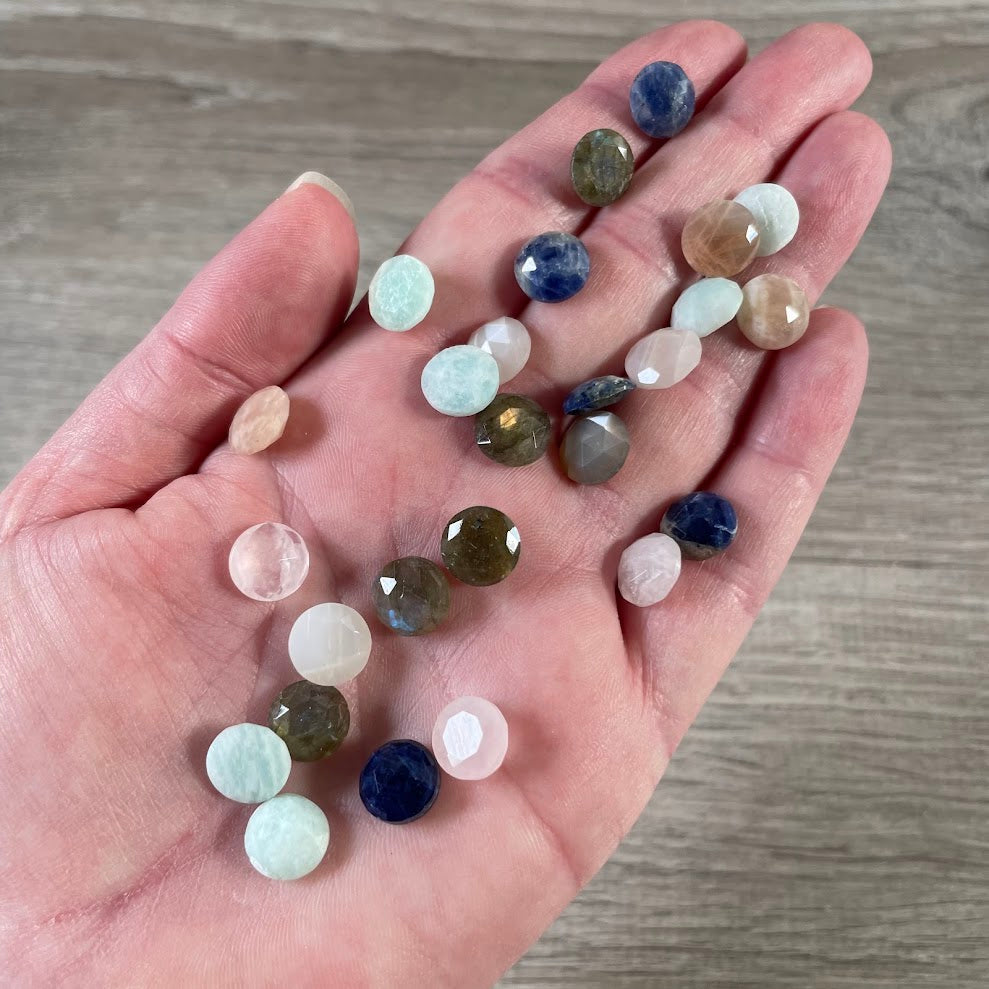 Assorted Wholesale round crystal cabochons with faceted tops