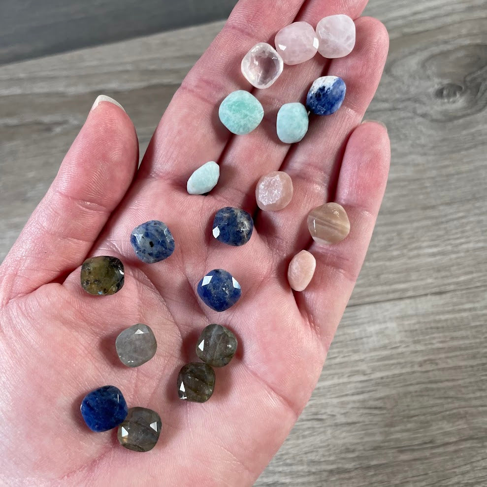 Assorted wholesale gemstone cabochons in small faceted square shapes