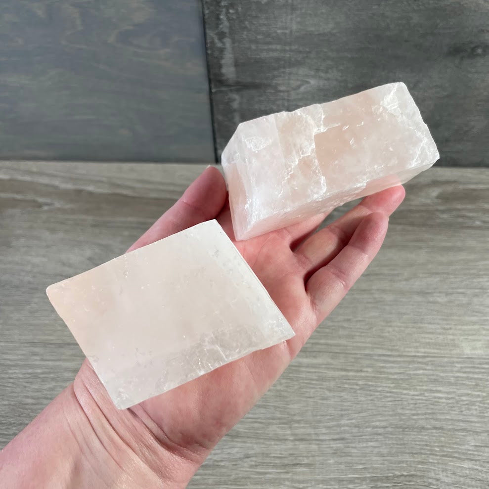 Natural pink calcite stones with geometric rhombose shape