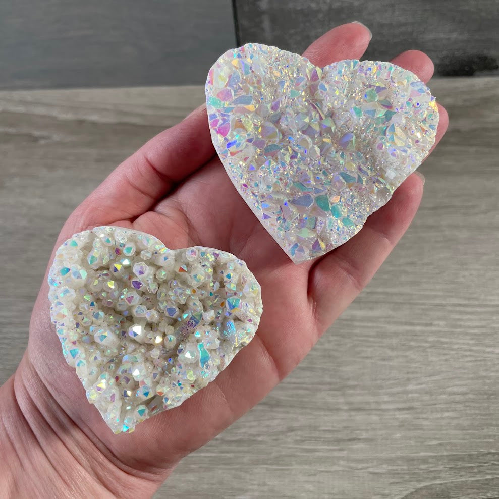 Aura quartz crystal heart cluster with metallic rainbow coating for boutique resale
