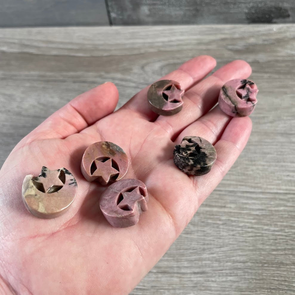 Bulk rhodonite crescent moon gemstone carving with celestial star design