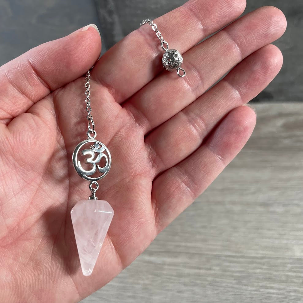 Rose quartz chakra balancing pendulum with sacred Om charm