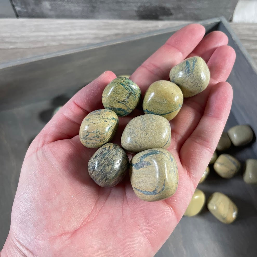Wholesale polished Banded Jasper pocket stones with varied colors and patterns