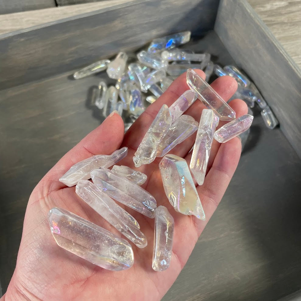 Wholesale rainbow aura quartz points display