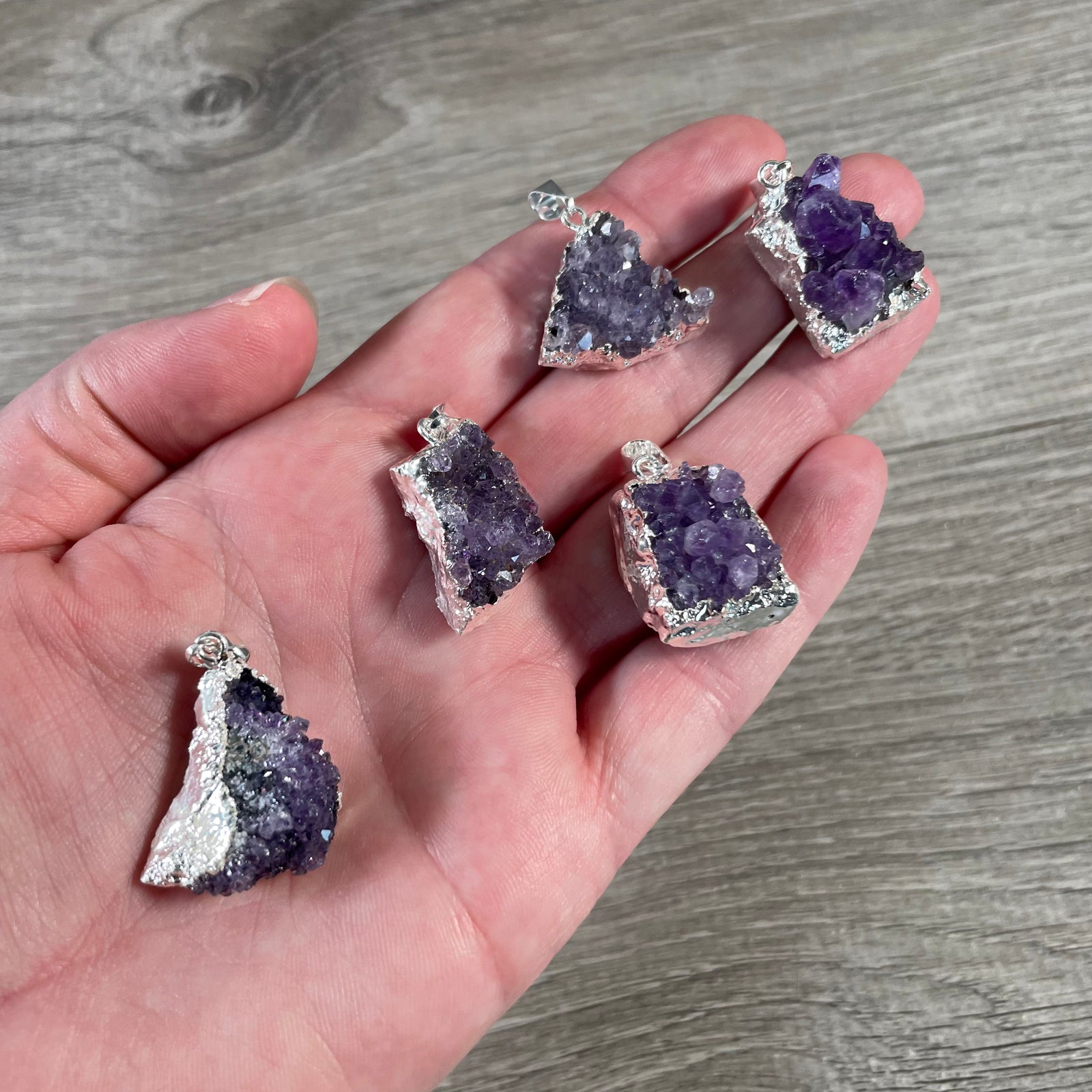 raw amethyst cluster pendant with electroplated edges for resale