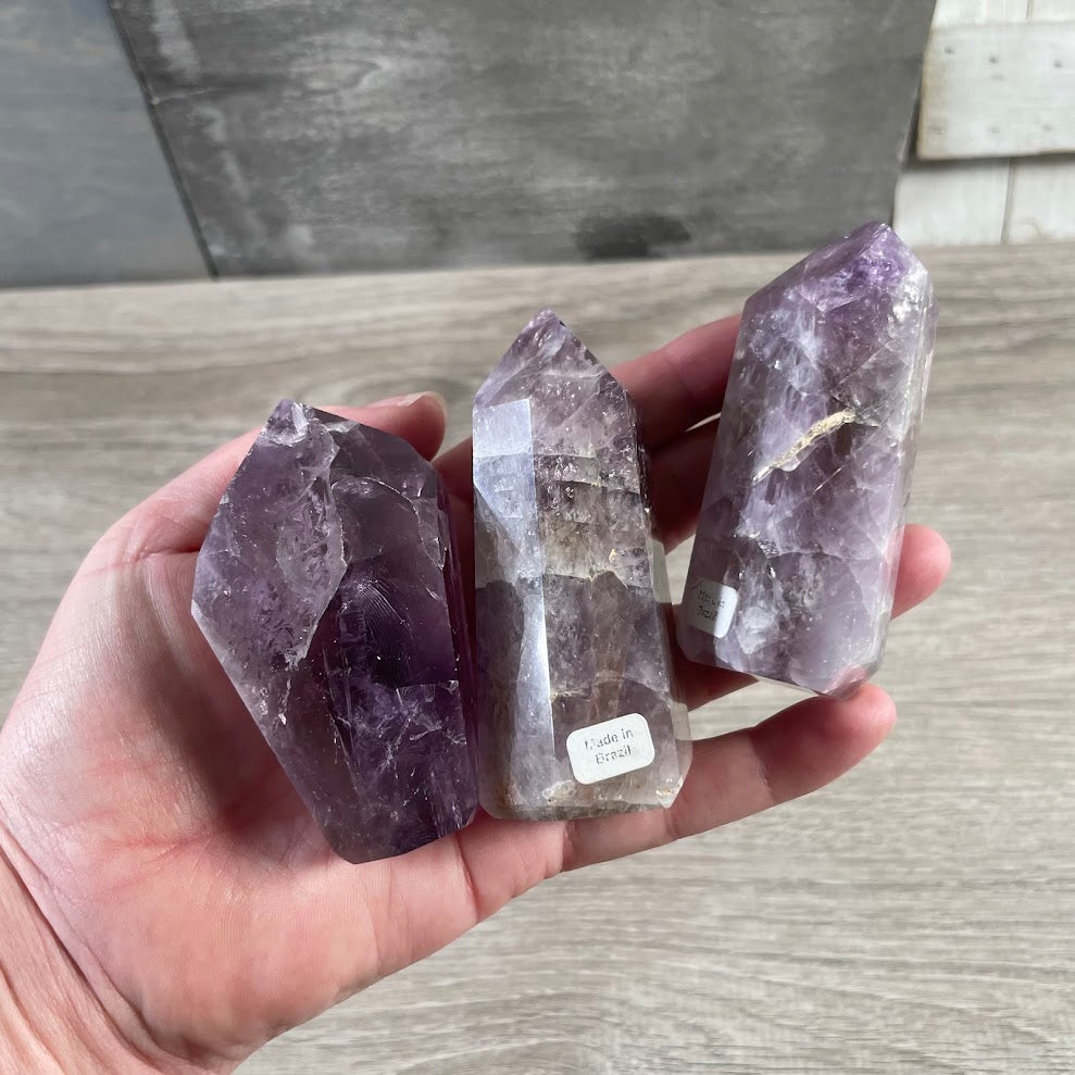 Polished stone crystal points in obelisk shapes for wholesale resale and shop inventory