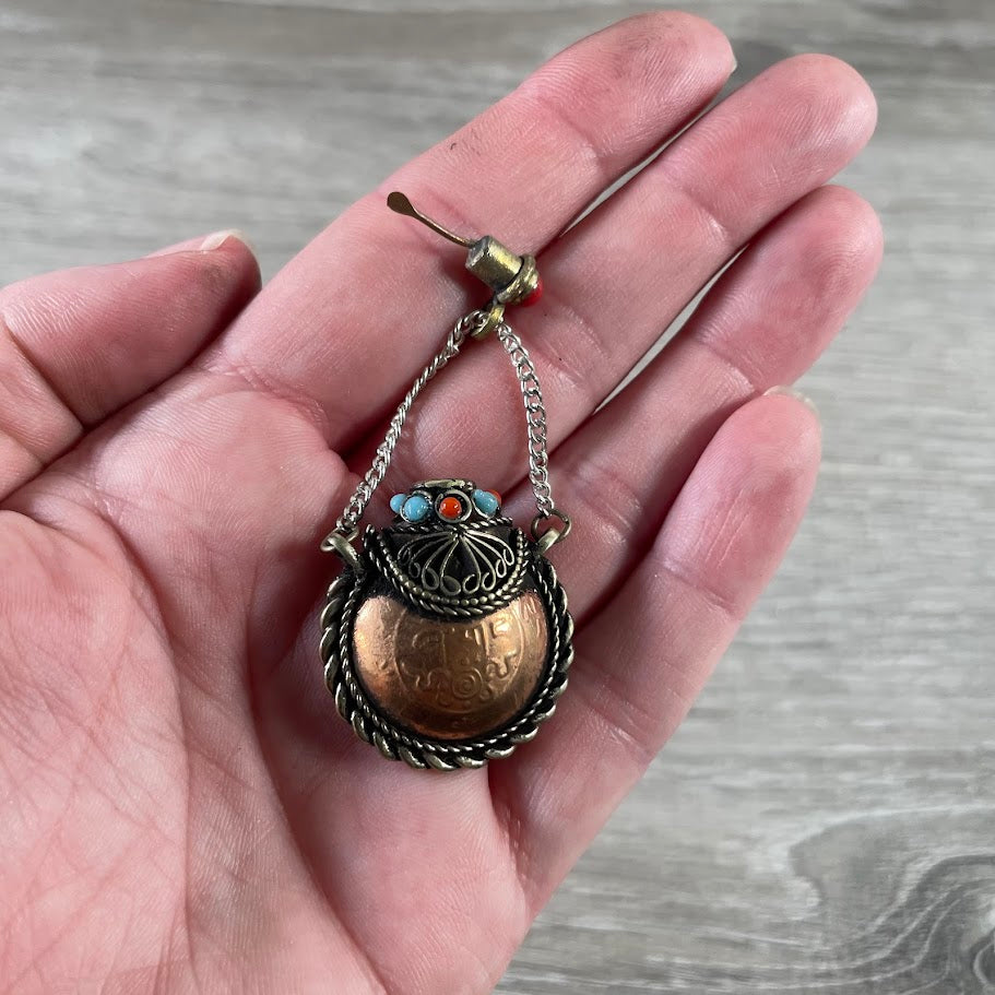 Small metal stash bottles for crystals, herbs