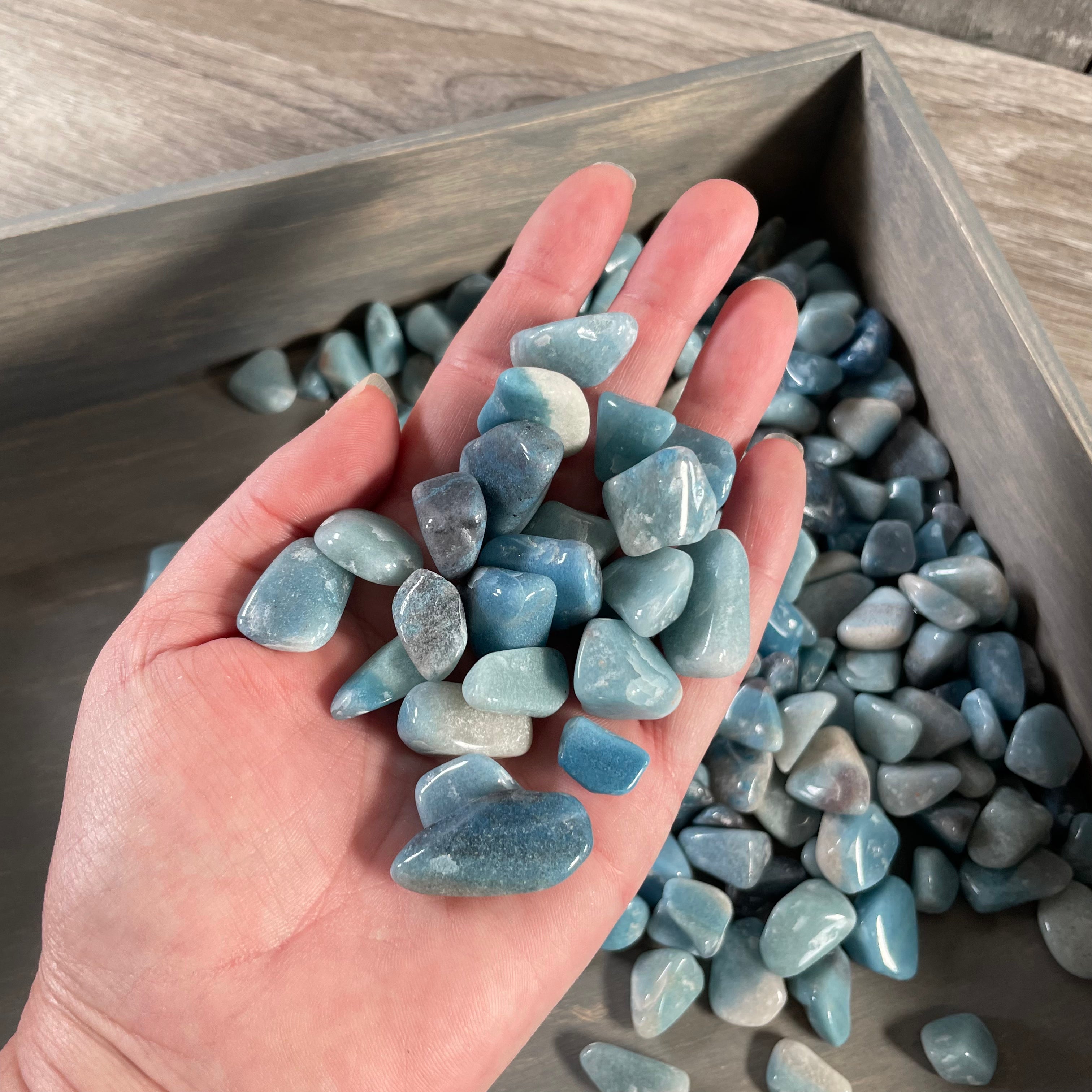 Trollite tumbled stones in shades of blue and gray sold by the kilo for wholesale and resale.