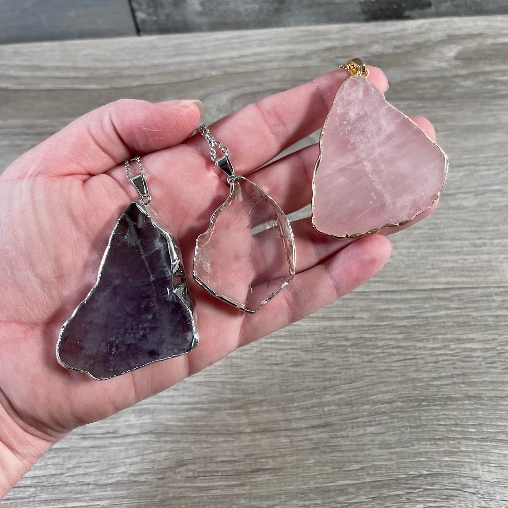 Natural mixed quartz crystal pendants with metal edging for boutiques and gift shops