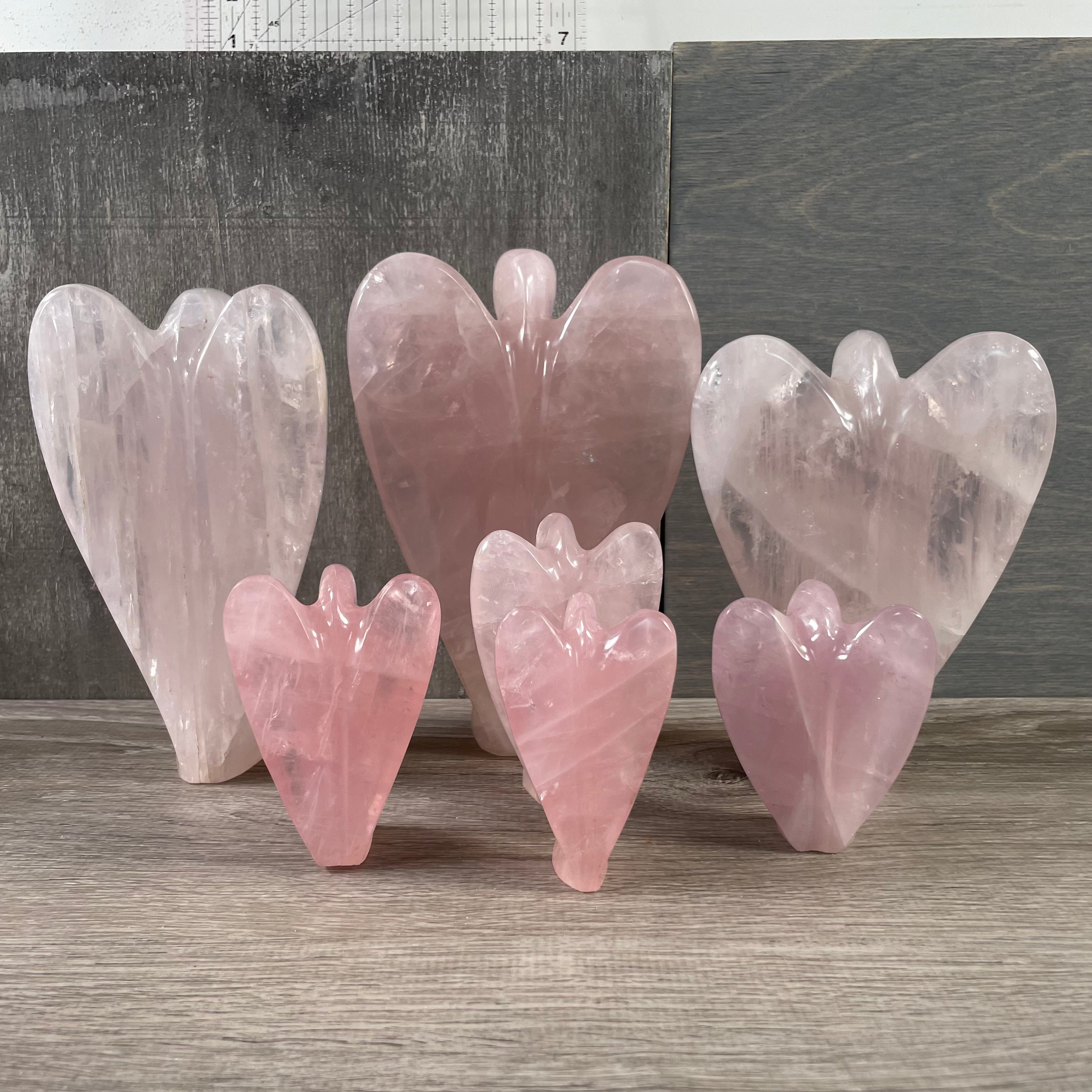 Rose quartz angel lot back facing, standing. 