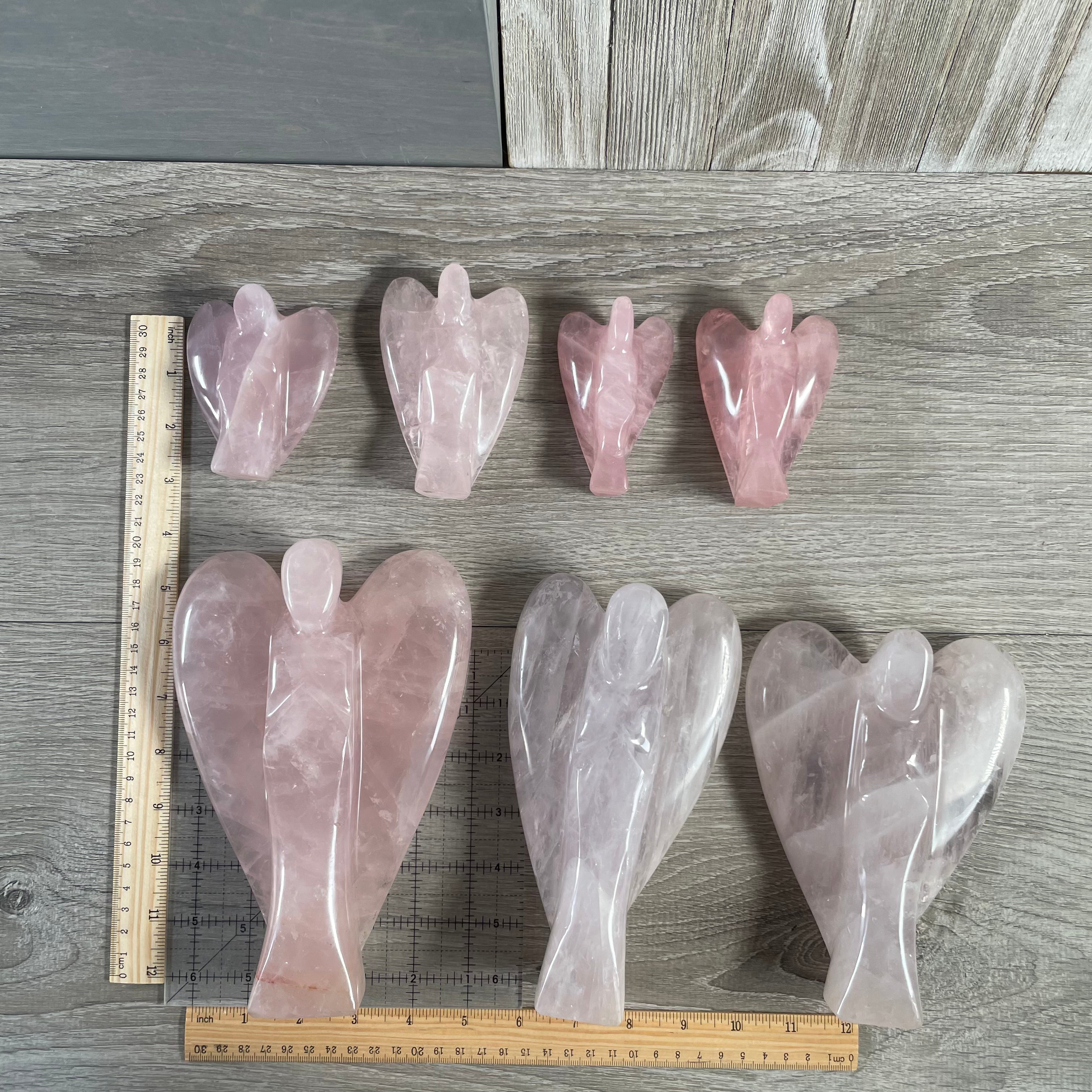 Rose quartz angels with size reference.
