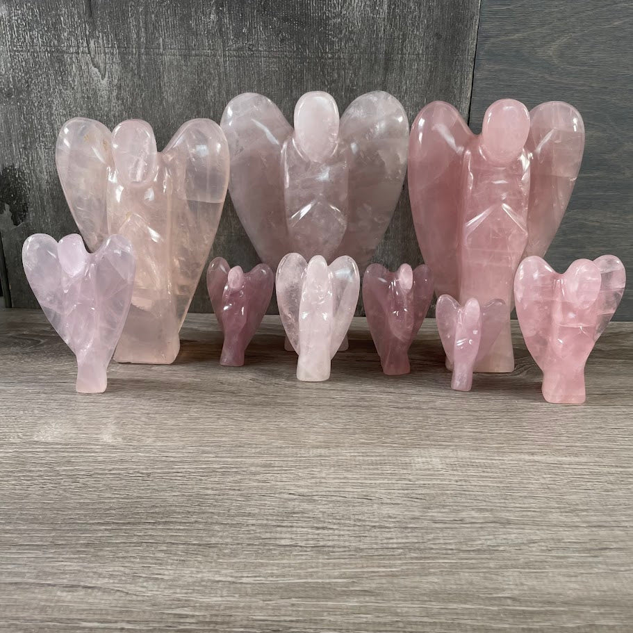 Lot of 9 rose quartz angels (3 large), standing facing forward. 